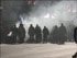 Wide shot of a group of people in mid-stride